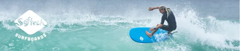 Surfer using a Softech surfboard